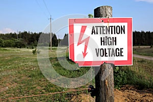 High Voltage Warning Sign posted on a telephone pole