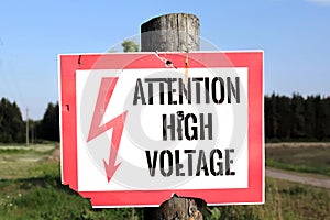High Voltage Warning Sign posted on a telephone pole