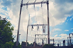 High-voltage wires on poles under high voltage. Tinted image. Power plants on the industry. photo