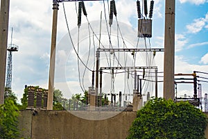 High-voltage wires on poles under high voltage. Tinted image. Power plants on the industry. photo