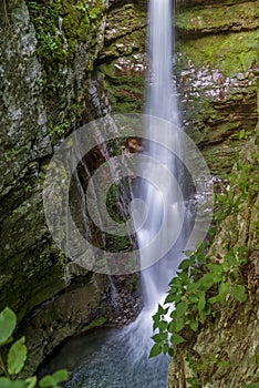 High waterfall in the mountain canyon