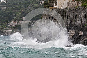 High waves crash violently on the coast, Minori, Costiera Amalfitana, Campania, Italy
