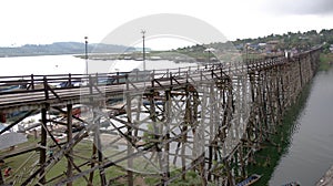 High wooden bridge with Raft village on the big lake near border of Thailand and Myanmar,