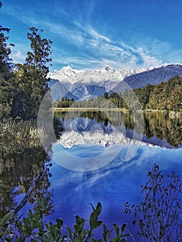 Highest New Zealand mountain Mount Cook reflecting in the waters of Lake Matheson on the South Island of New Zealand