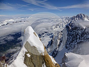 Highest panoramic platform on mountain peak Aiguille du Midi in France above ski village Chamonix Mont-Blanc