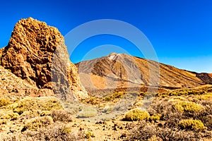 Highest Peak Behind A Large Lava Rock On A Sunny And Very Clear Day In El Teide National Park. April 13, 2019. Santa Cruz De