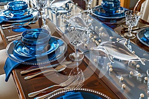 highgloss table with reflective blue tableware, crystal dolphins, and pearlstrewn runners