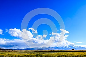 Highland with snow mountain