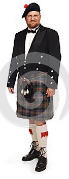 Highlander in kilt on white