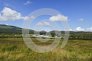 Highlands of Scotland with the whisky Distillery Dalwhinnie in  background