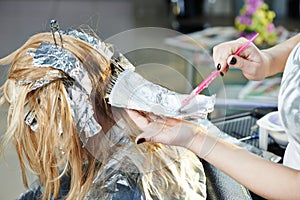 Highlight. woman hairdressing in salon photo