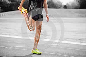 Highlighted bones of athlete man stretching on race track