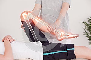 Highlighted bones of woman at physiotherapist photo