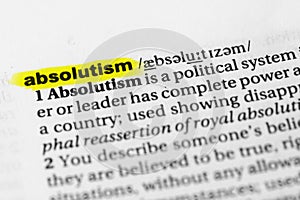 Highlighted English word `absolutism` and its definition in the dictionary photo