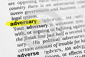 Highlighted English word `adversary` and its definition in the dictionary photo
