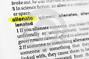 Highlighted English word `alienate` and its definition in the dictionary