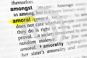 Highlighted English word `amoral` and its definition in the dictionary