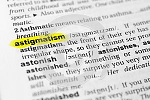 Highlighted English word `astigmatism` and its definition in the dictionary