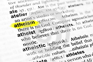 Highlighted English word `atheism` and its definition in the dictionary