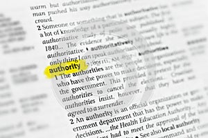 Highlighted English word authority and its definition at the dictionary