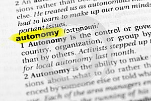 Highlighted English word `autonomy` and its definition in the dictionary