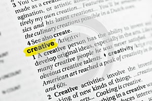 Highlighted English word creative and its definition at the dictionary.