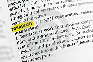 Highlighted English word research and its definition at the dictionary