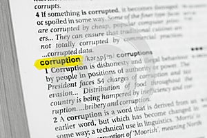 Highlighted English word & x22;corruption& x22; and its definition at the dictionary photo