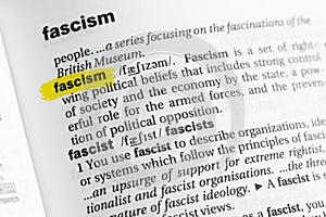 Highlighted English word & x22;fascism& x22; and its definition at the dictionary photo