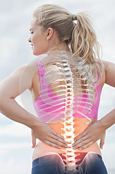 Highlighted spine of woman with back pain