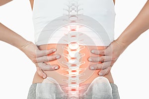 Highlighted spine of woman with back pain