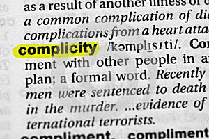 Highlighted word complicity concept and meaning photo