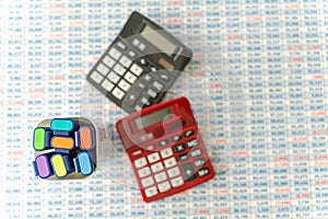 Highligters with Calculators on top of Spreadsheet background