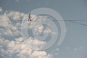 Highliner walks on a tightrope against the backdrop of the firmament photo