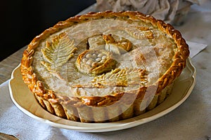 A highly decorated pie crust.