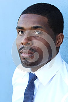 Highly detailed close-up portrait of a young smart successful African business man