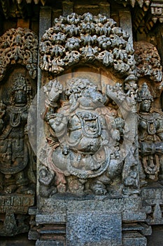 Highly detailed intrinsic carvings of Ganesha at 800 year old hindu temple at Somnathpur, Karnataka, India photo