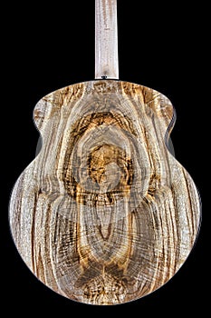 Highly figured Myrtlewood on the back of a uniquely shaped acoustic guitar