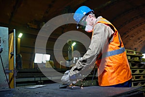 Highly Professional Worker Using Angle Grinder