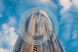 Highrise skyscraper building with glass windows. Global corporate background