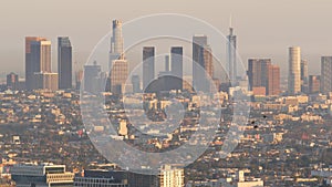 Highrise skyscrapers of metropolis in smog, Los Angeles, California USA. Air toxic pollution and misty urban downtown skyline.