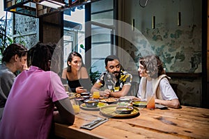 Highschool students having a lunch in a modern cafe