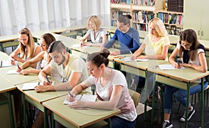 Highschool students learning in classroom