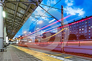 Highspeed train departs from the station platform.