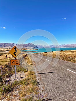 Highway around Mount Cook, winding past Lake Pukaki amidst New Zealand