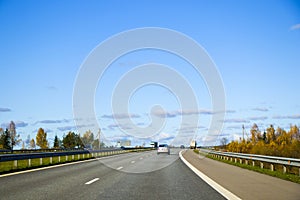 Highway, autobahn and road landscape. Automobile, cars and vehicles. Blue sky and sunny day. European autobahn