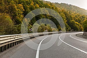 Highway and autumn landscape with vibrant fall colors.