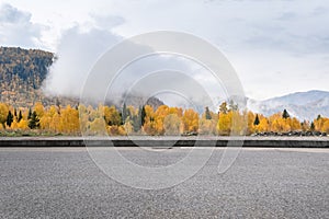 Highway with autumn mountainous area background