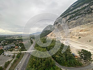 Highway below the tall mountain peak