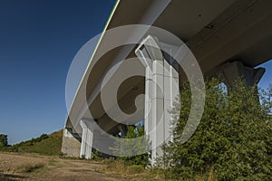 Highway bridge with blue sky near Kamenny Dvur village in summer morning